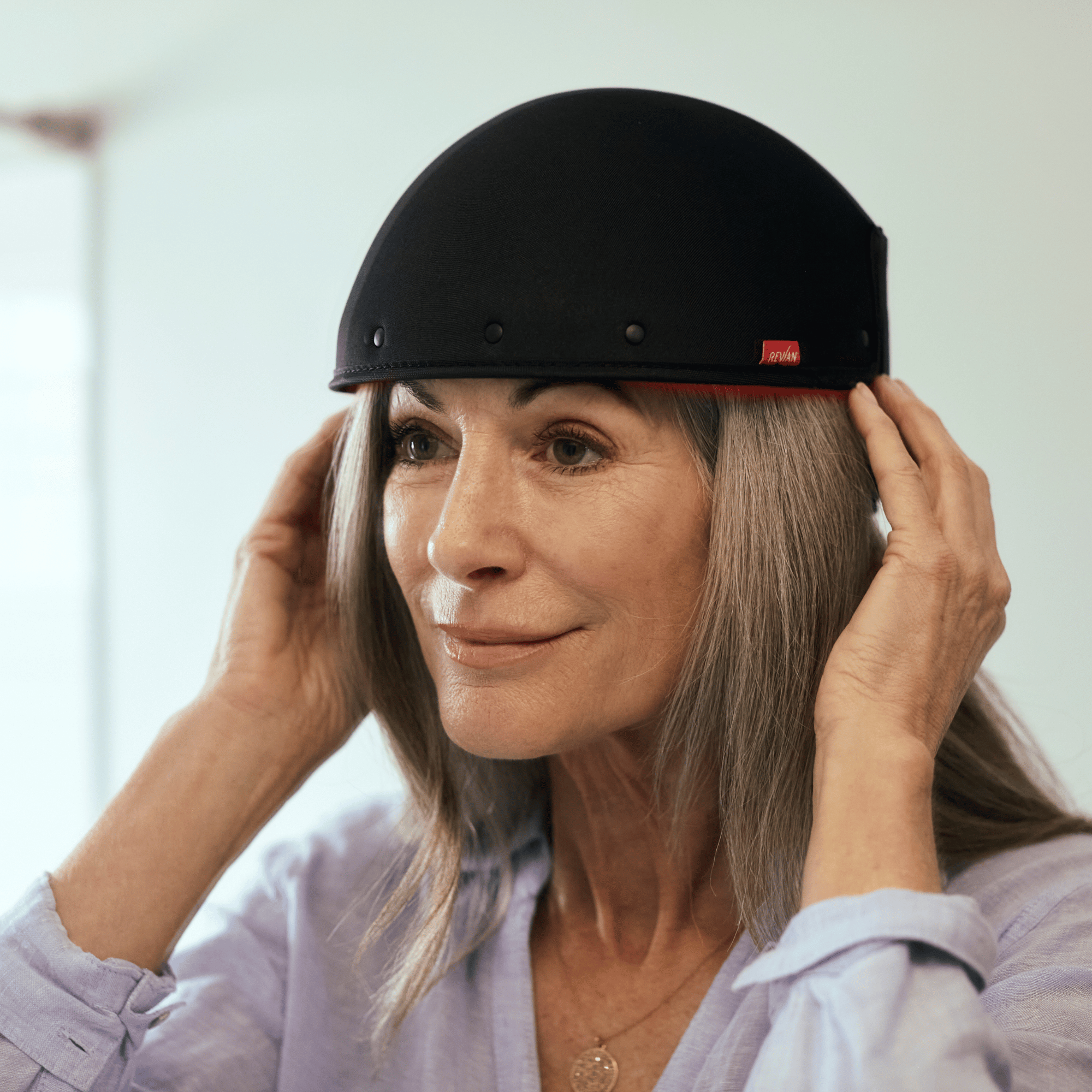 REVIAN Red Hair Growth System LED therapy cap designed to improve hair density and thickness with dual-wavelength light technology. Available at Exclusive Beauty Club.