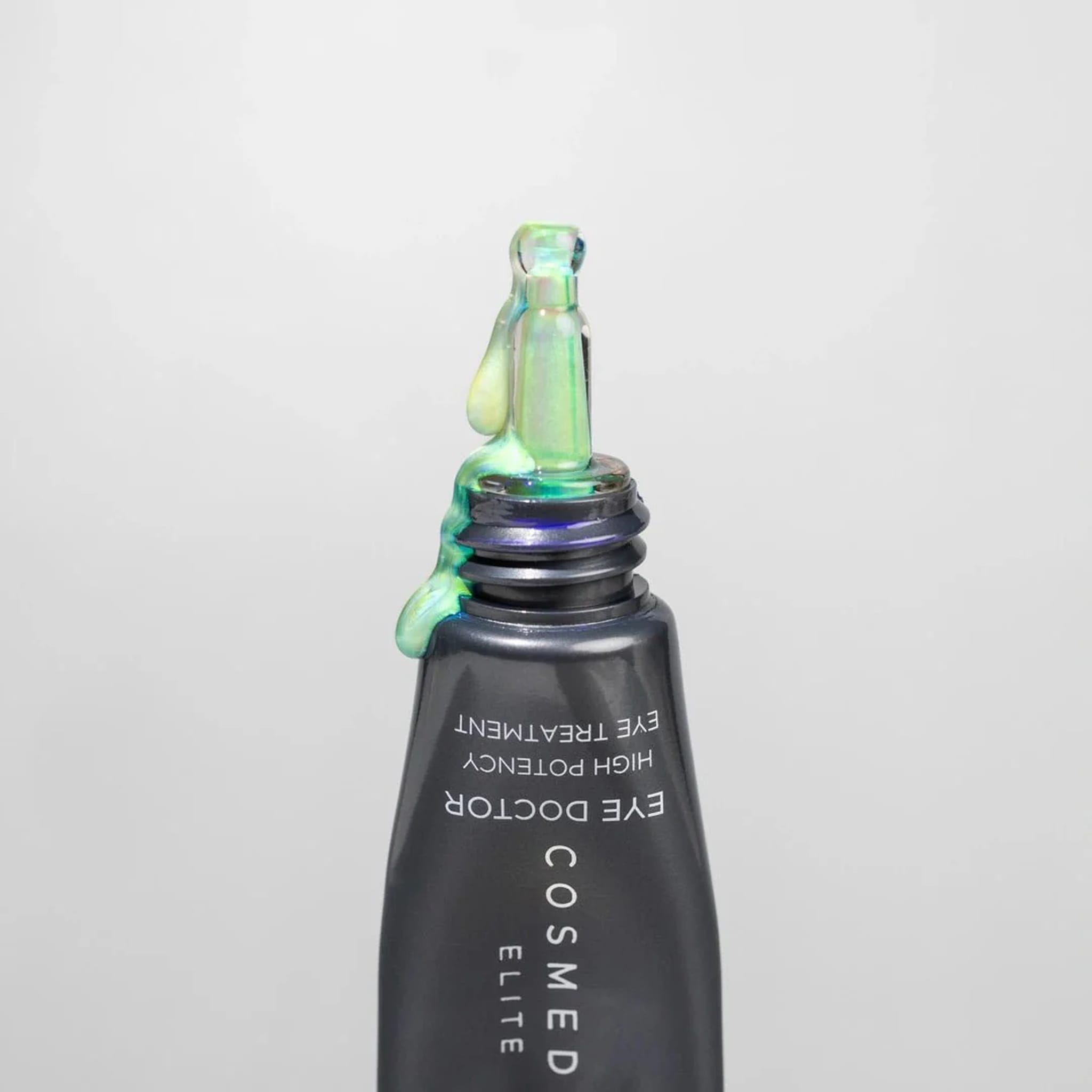 Cosmedix Eye Doctor tube tip with shimmering eye treatment gel emerging