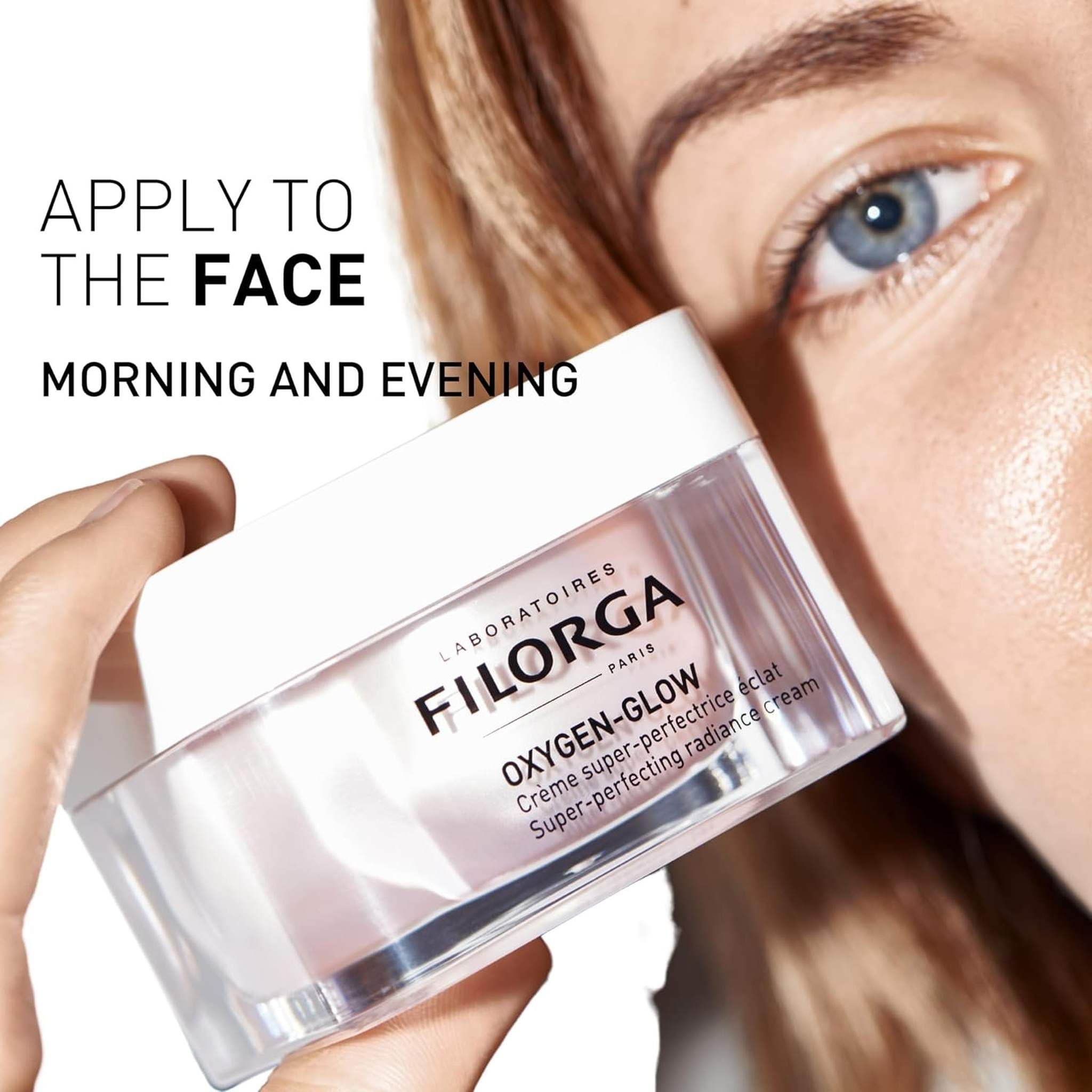 Filorga Oxygen-Glow radiance cream held by woman apply to face morning and evening