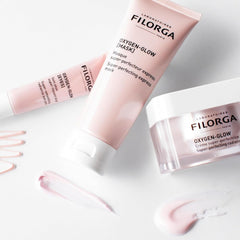 Filorga Oxygen-Glow collection cream mask and Eyes radiance skincare range pink products flatlay
