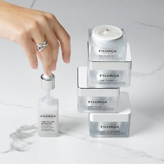 Filorga Time-Filler collection 5XP cream gel night cream Eyes 5XP and Intensive serum stacked on marble