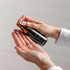 Osmosis Rescue MD repair serum pumped into palm showing how to apply 2 pumps to clean skin