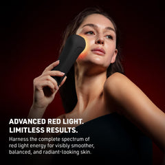 Woman using a red light device on her face with text about advanced red light therapy.