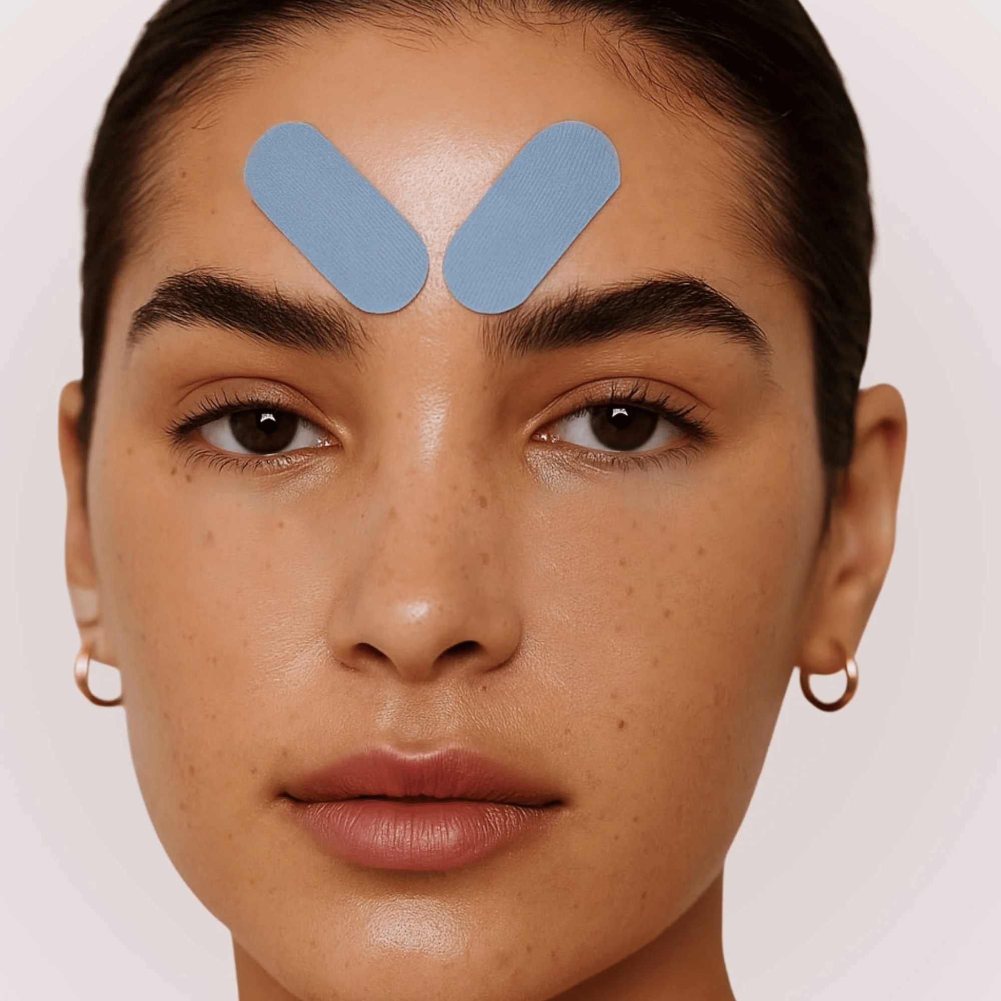 Solaris Laboratories NY Kinesiology Face Tape strips for overnight facial lifting and smoothing. Available at Exclusive Beauty Club.