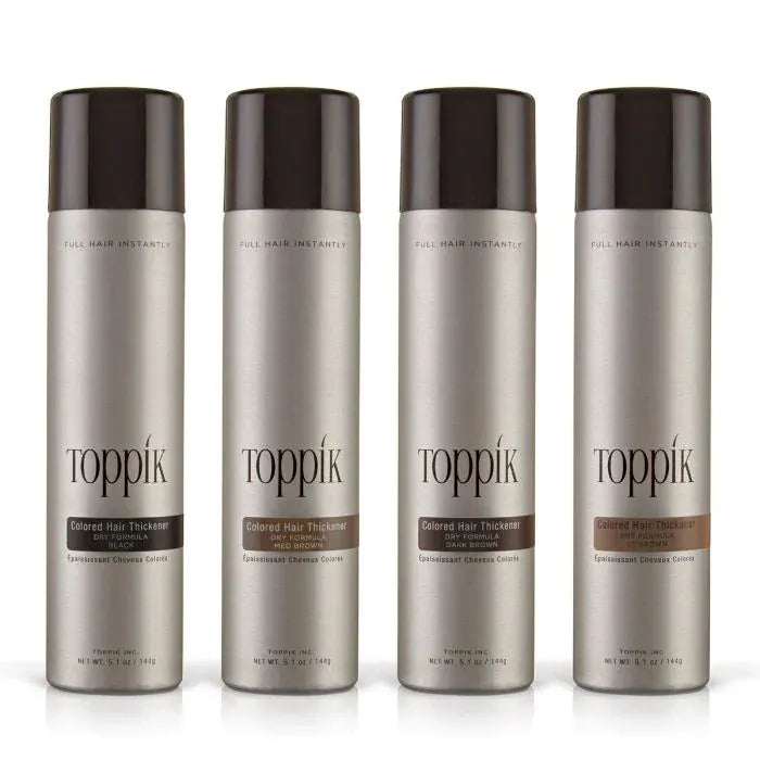 Four bottles of Toppik hair thickening product on a white background 6