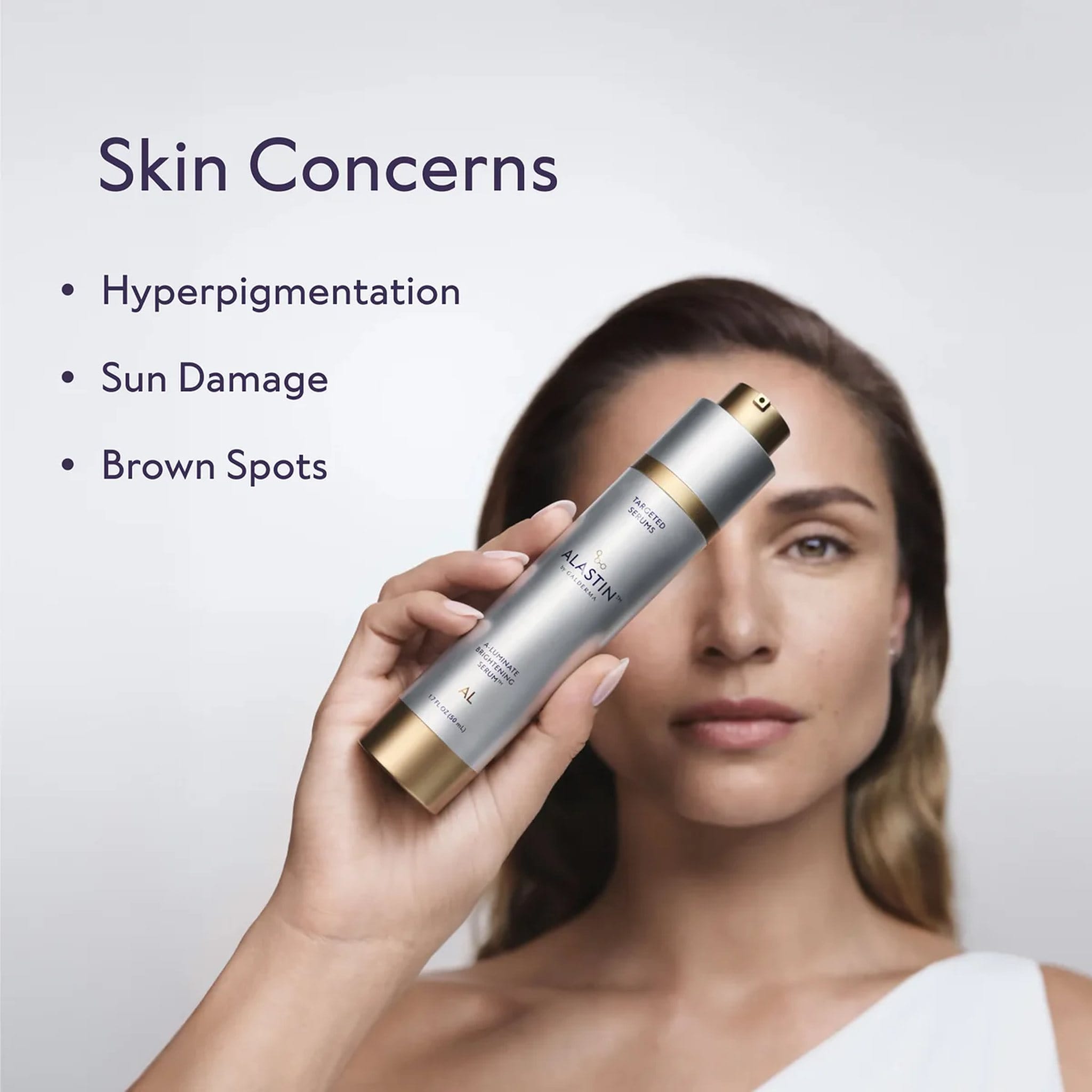 Woman holding ALASTIN A-Luminate Brightening Serum for hyperpigmentation sun damage and brown spots