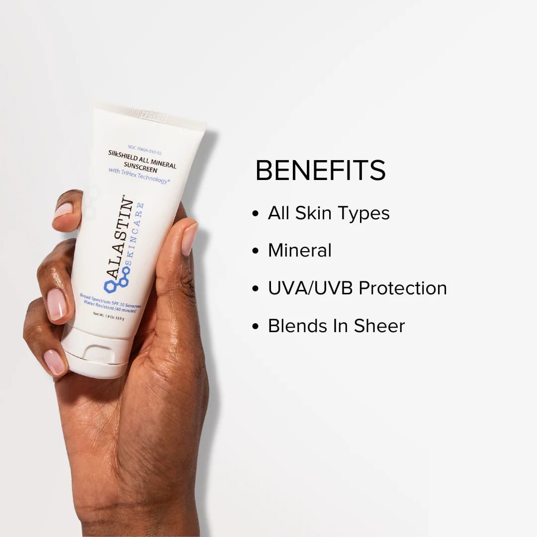 Hand holding ALASTIN SilkSHIELD mineral sunscreen with UVA UVB protection that blends in sheer on all skin types