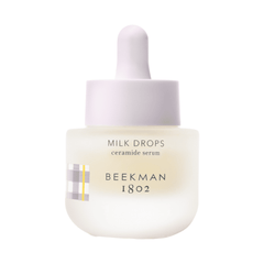 Beekman 1802 mini Milk Drops ceramide serum bottle with dropper on white background