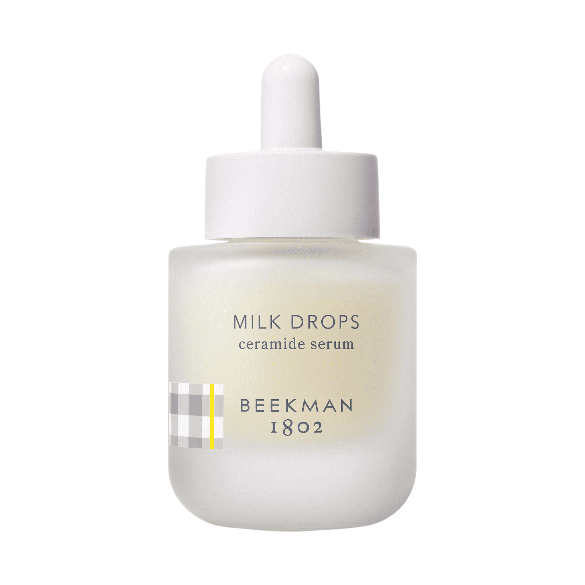 Beekman 1802 Milk Drops ceramide serum bottle with dropper on white background