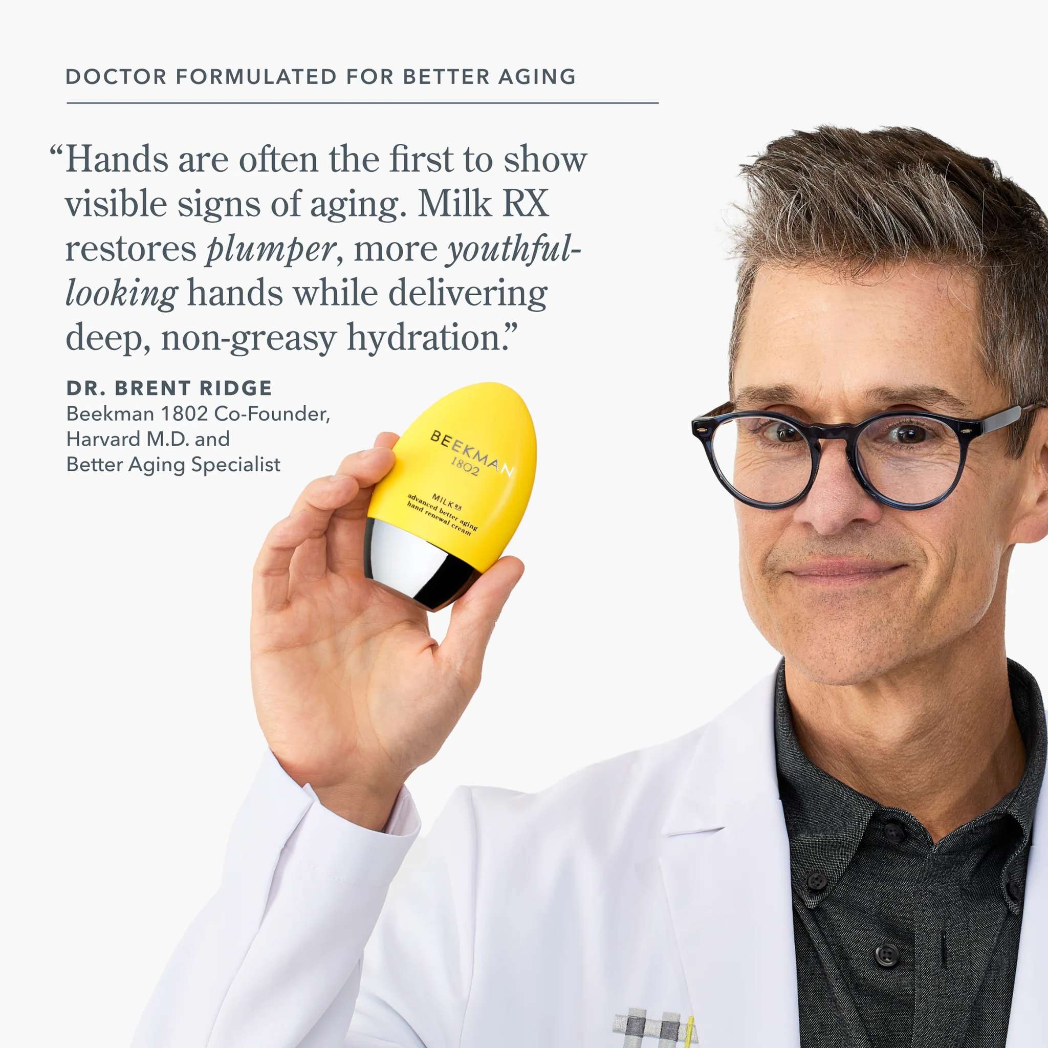 Dr Brent Ridge holding Milk RX hand cream formulated for plumper youthful looking hands