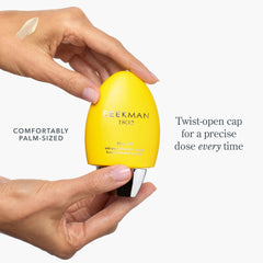 Hands holding palm sized Milk RX hand cream bottle with twist open cap