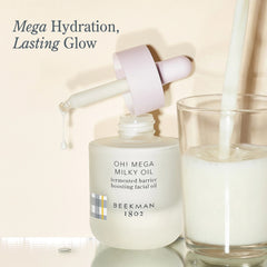 Oh Mega Milky Oil dropper pouring into a glass of milk for mega hydration and lasting glow