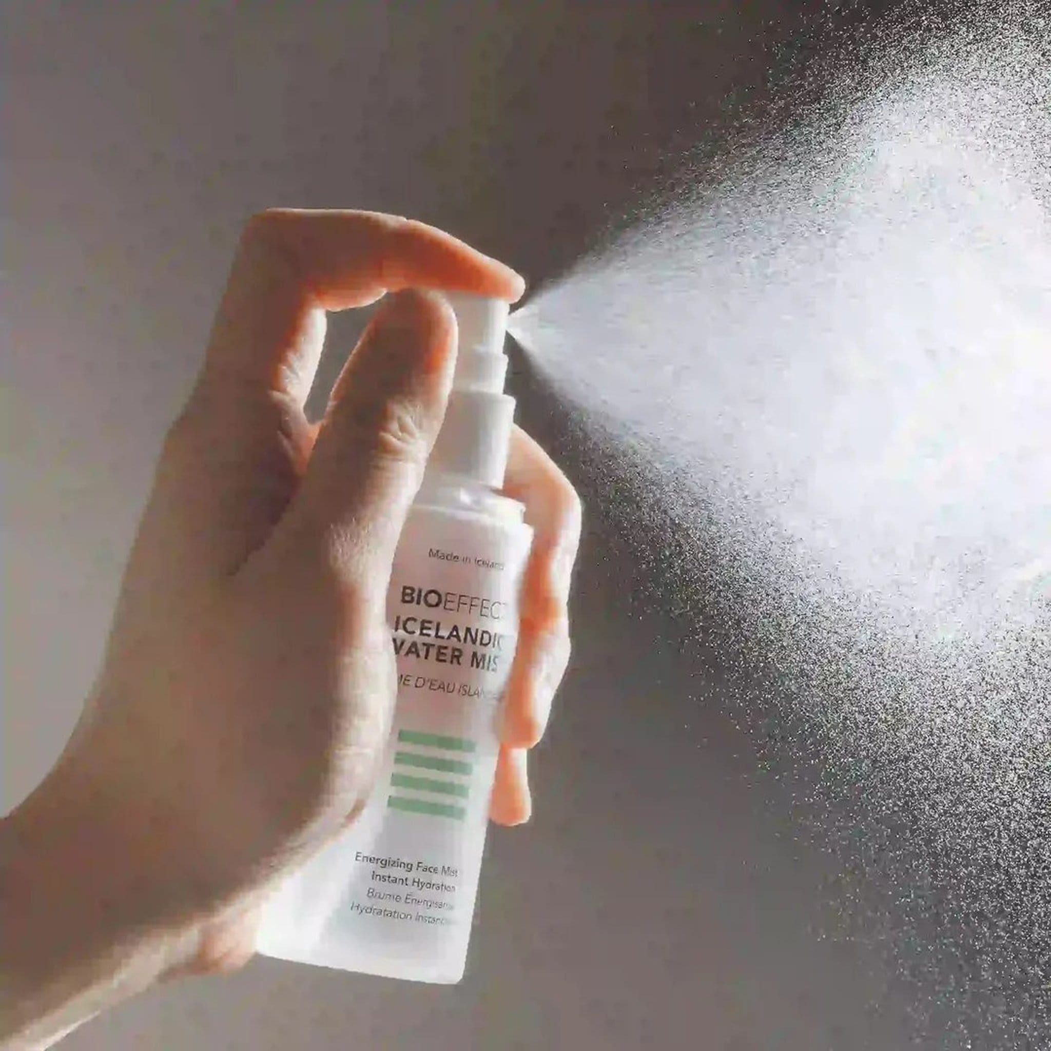 Hand spraying BIOEFFECT Icelandic Water Mist hydrating face mist
