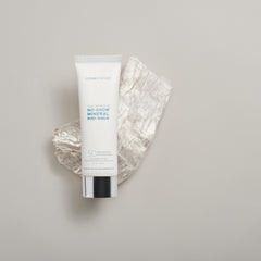 Colorescience No-Show Mineral Body Shield SPF 50 sunscreen hero shot resting on crystal