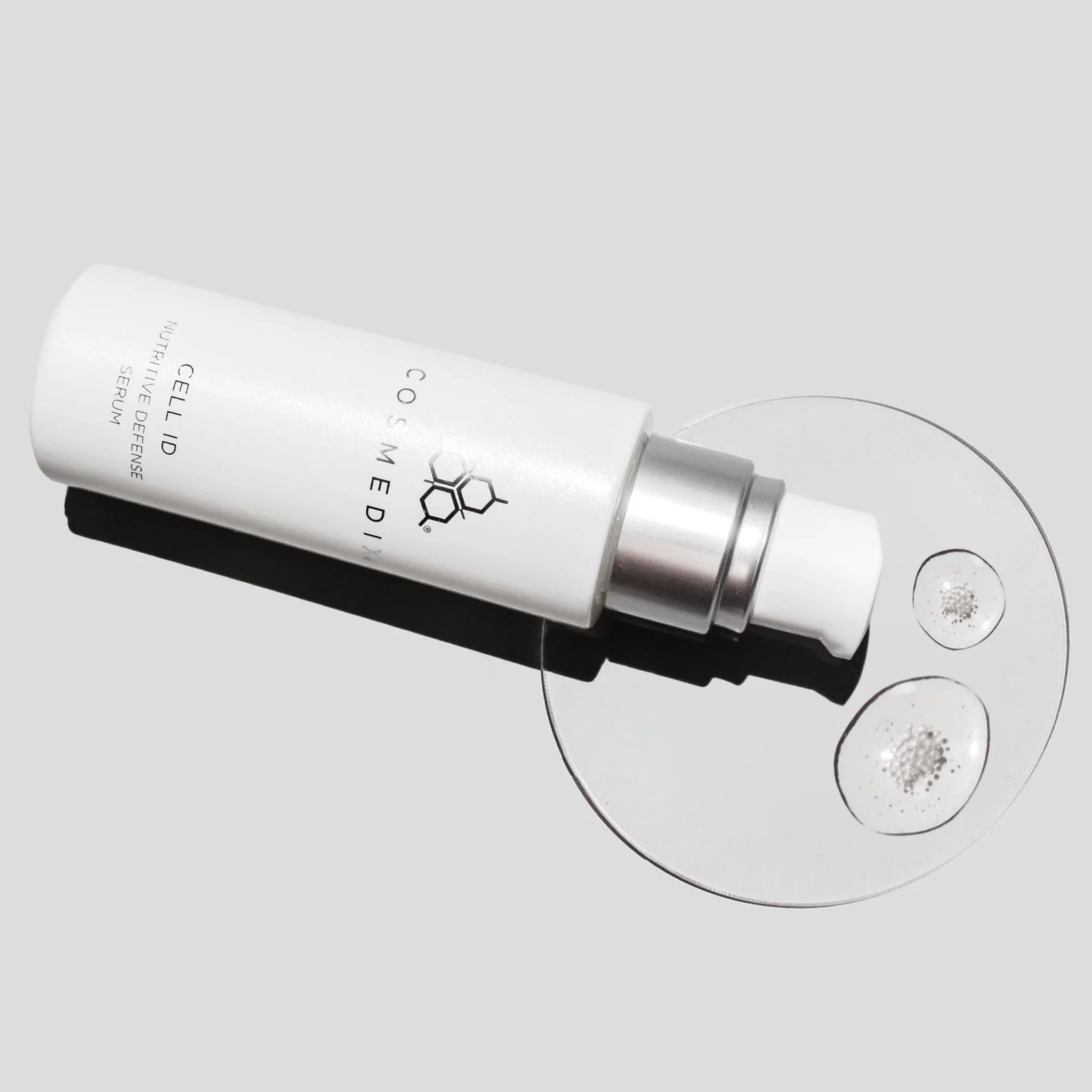 Cosmedix Cell ID serum texture swatch shown beside its tube
