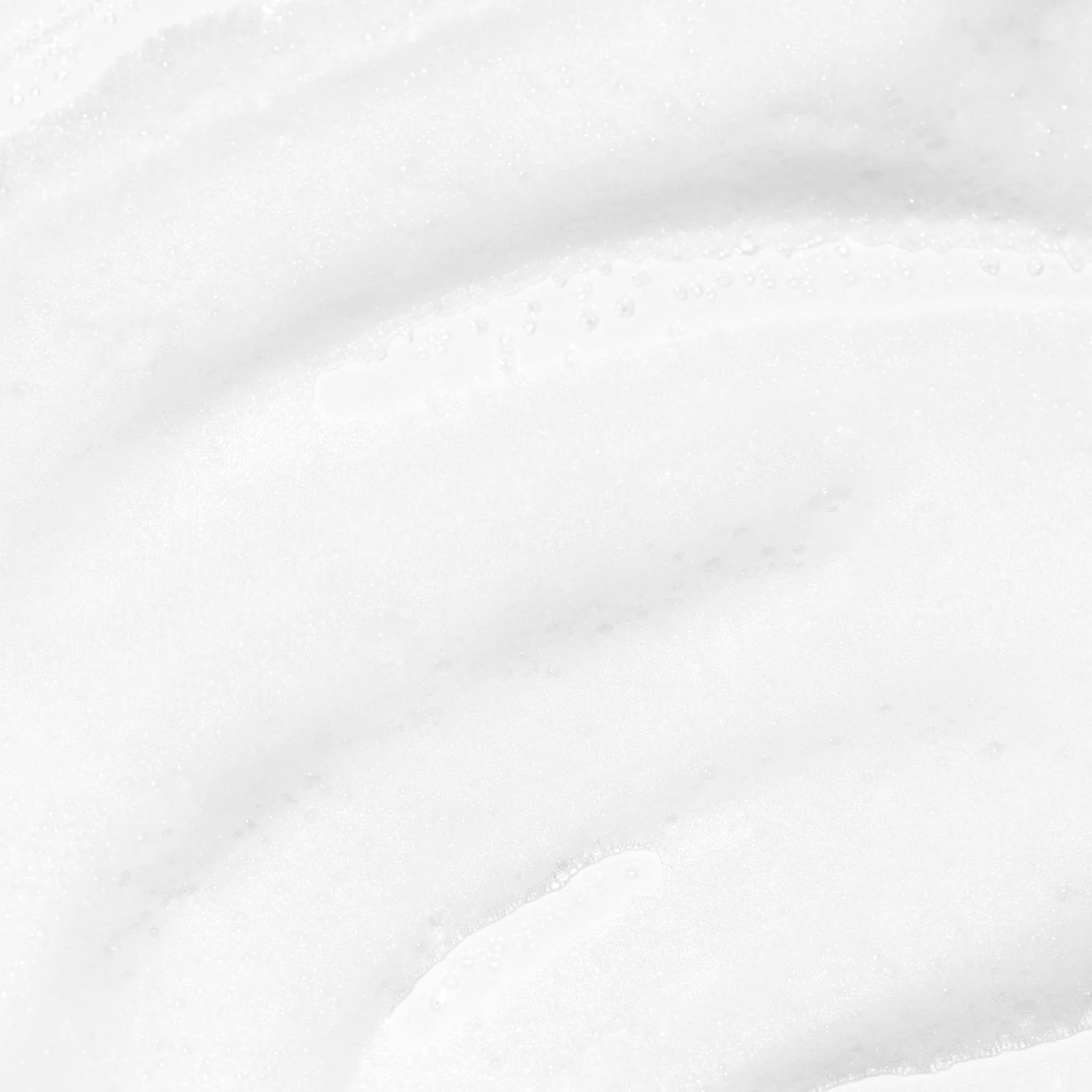 Close-up of Cosmedix Clarify salicylic acid foaming cleanser's whipped foam texture