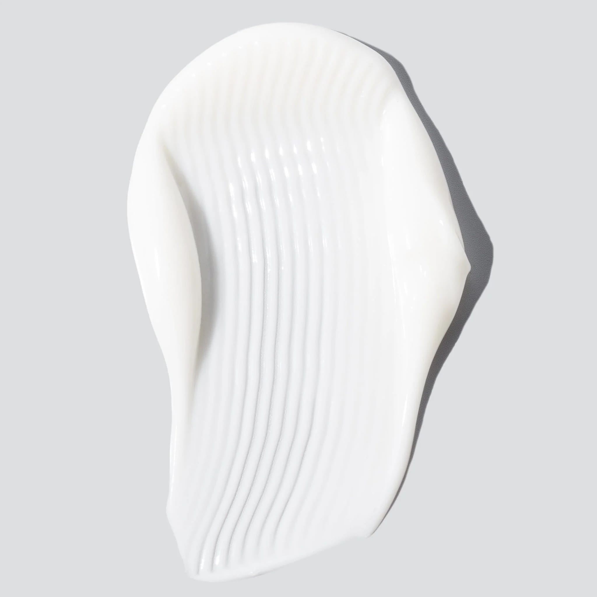 Cosmedix Harmonize moisturizer cream texture swatch with ribbed detail