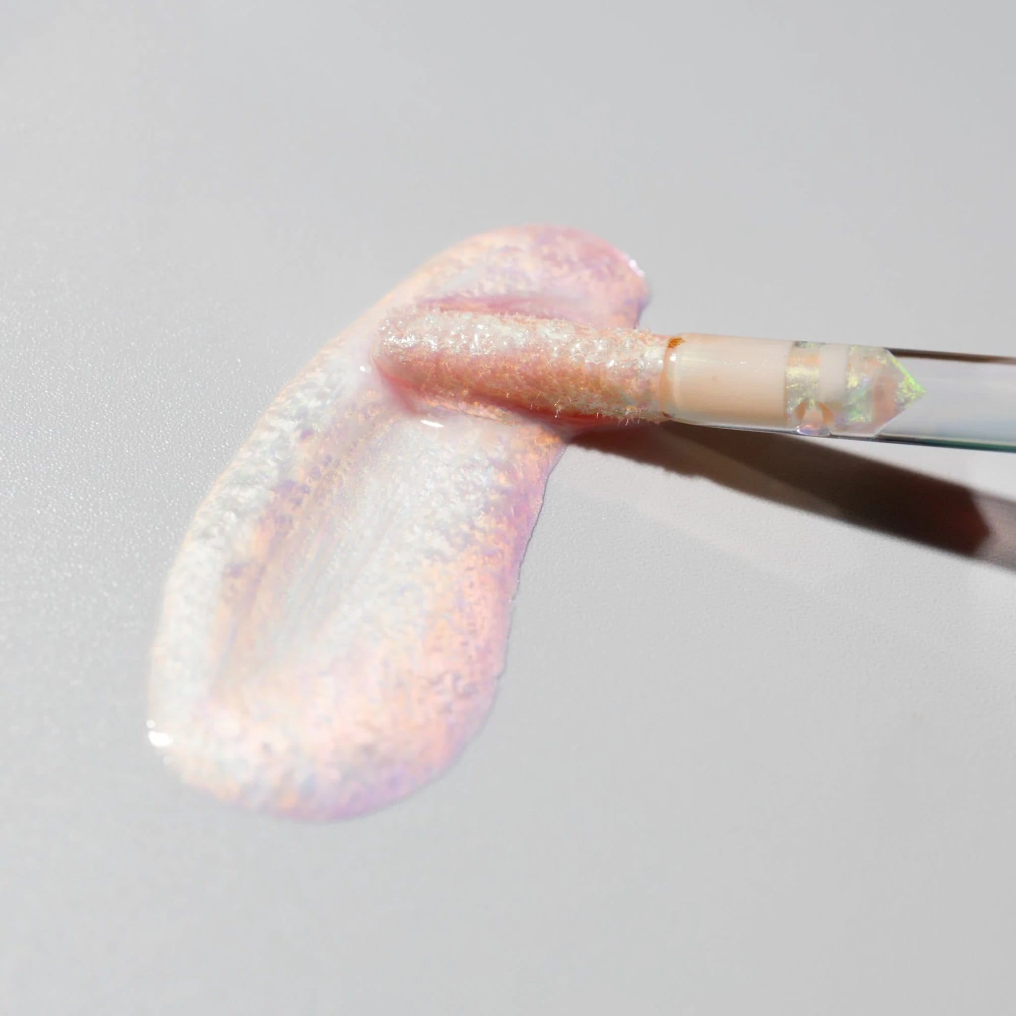 Cosmedix Lumi Crystal lip hydrator shimmer texture swatch with wand