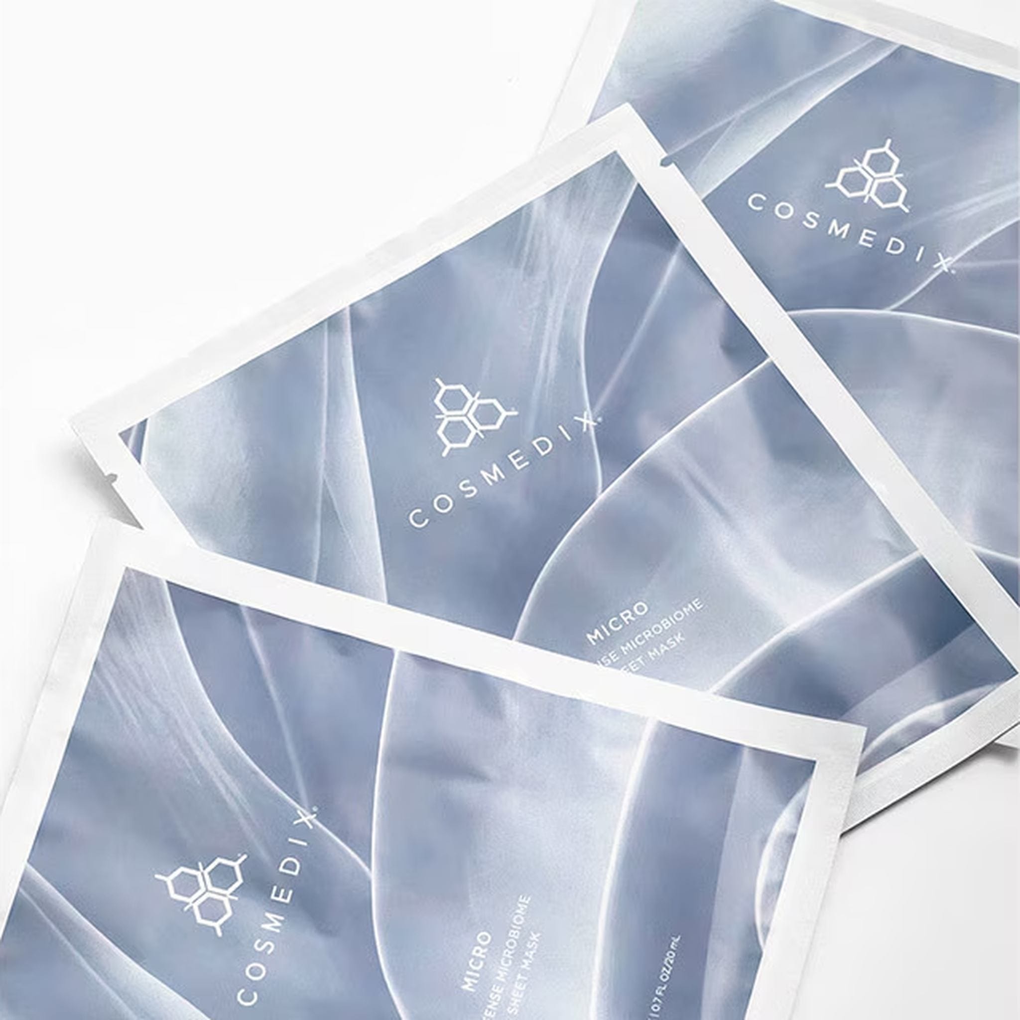 Three Cosmedix Micro Defense microbiome sheet mask foil packets fanned out