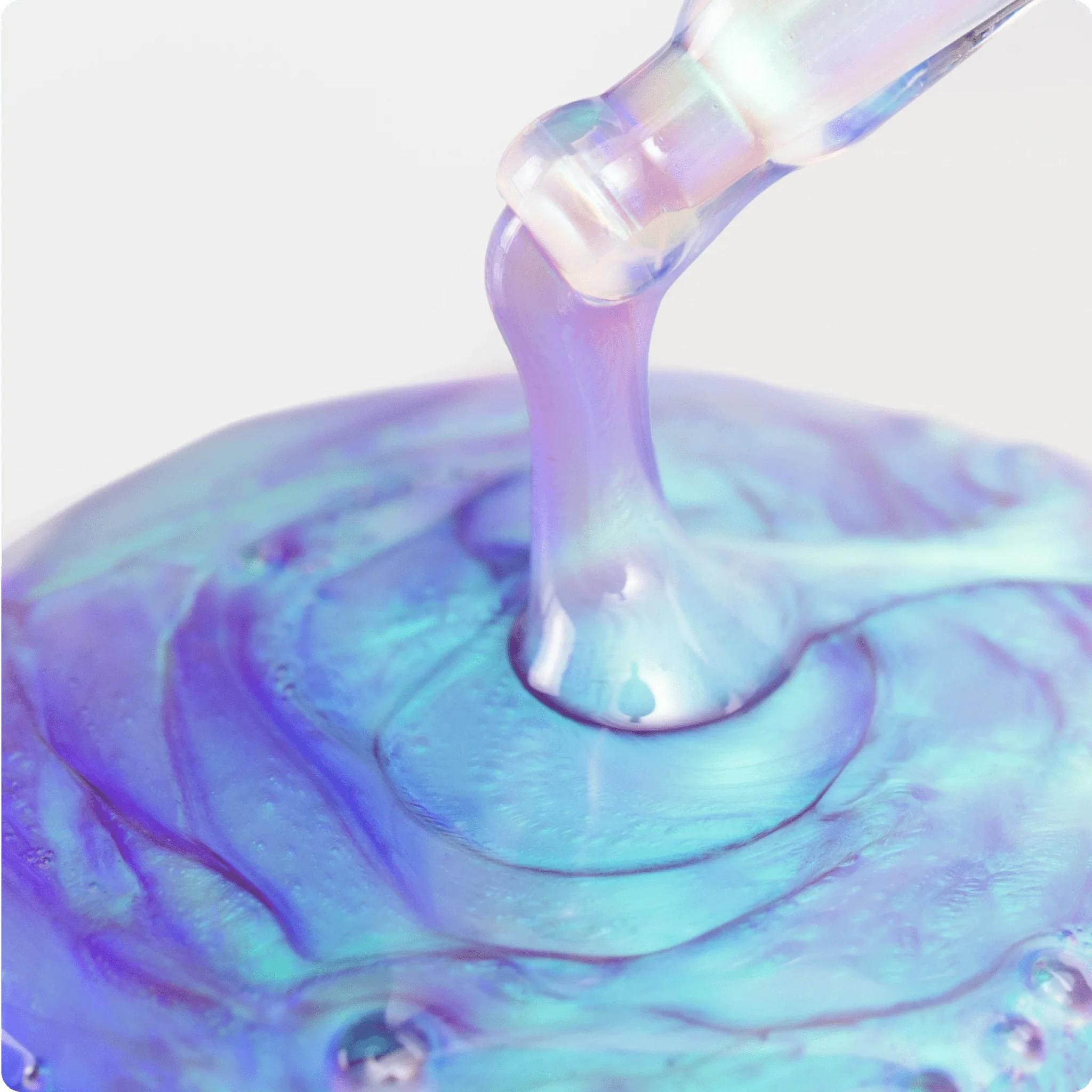 Cosmedix Opti Crystal eye serum's iridescent gel dripping in swirl