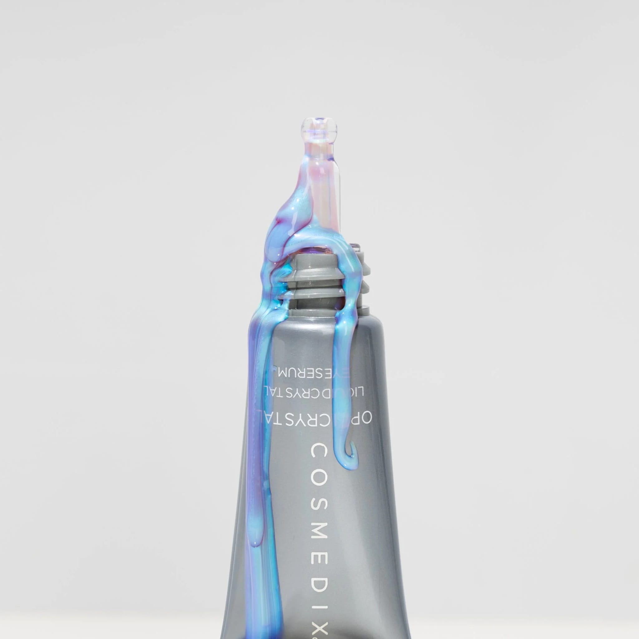 Cosmedix Opti Crystal eye serum tube tip with gel dripping down