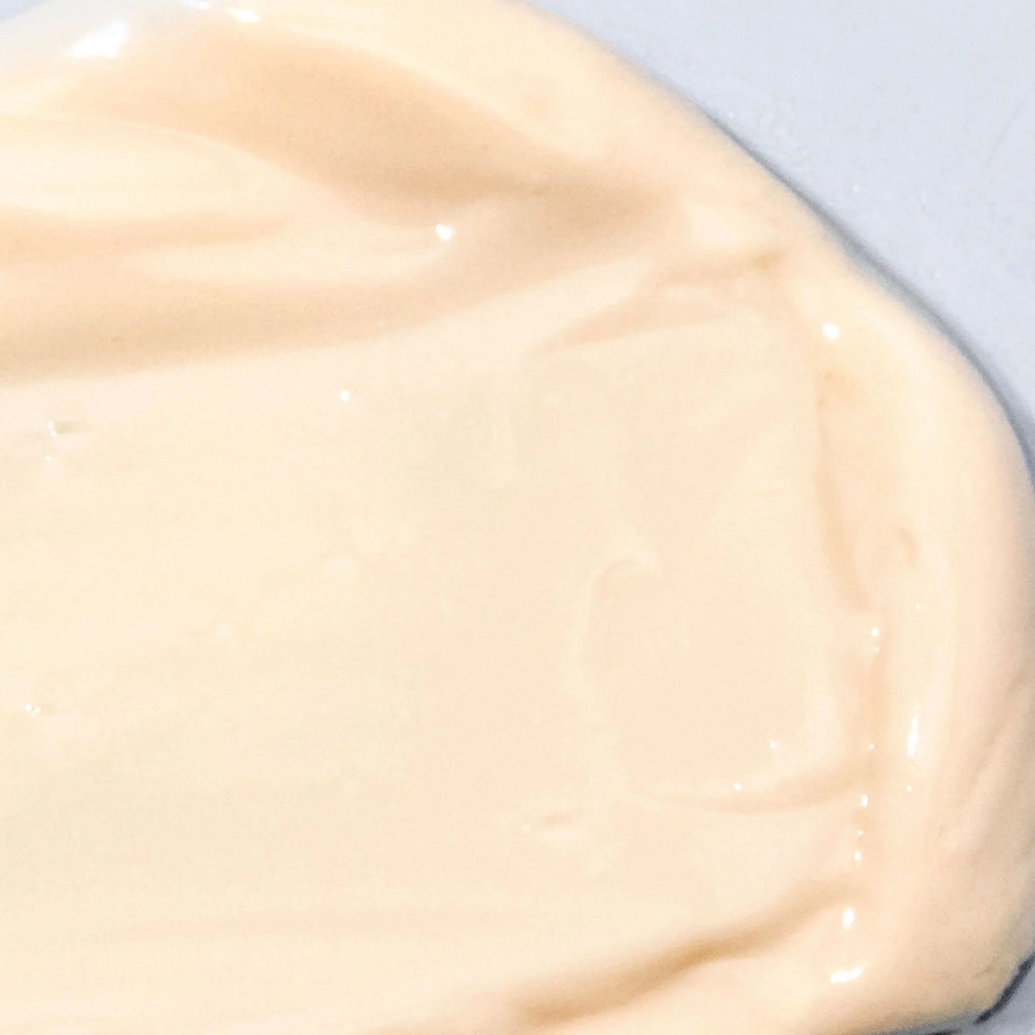 Close-up of Cosmedix Peptide-Rich Defense SPF 50 moisturizer's creamy texture