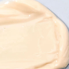 Close-up of Cosmedix Peptide-Rich Defense SPF 50 moisturizer's creamy texture