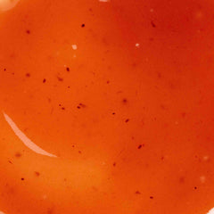 Close-up of Cosmedix Pure Enzymes cranberry exfoliating mask's speckled texture