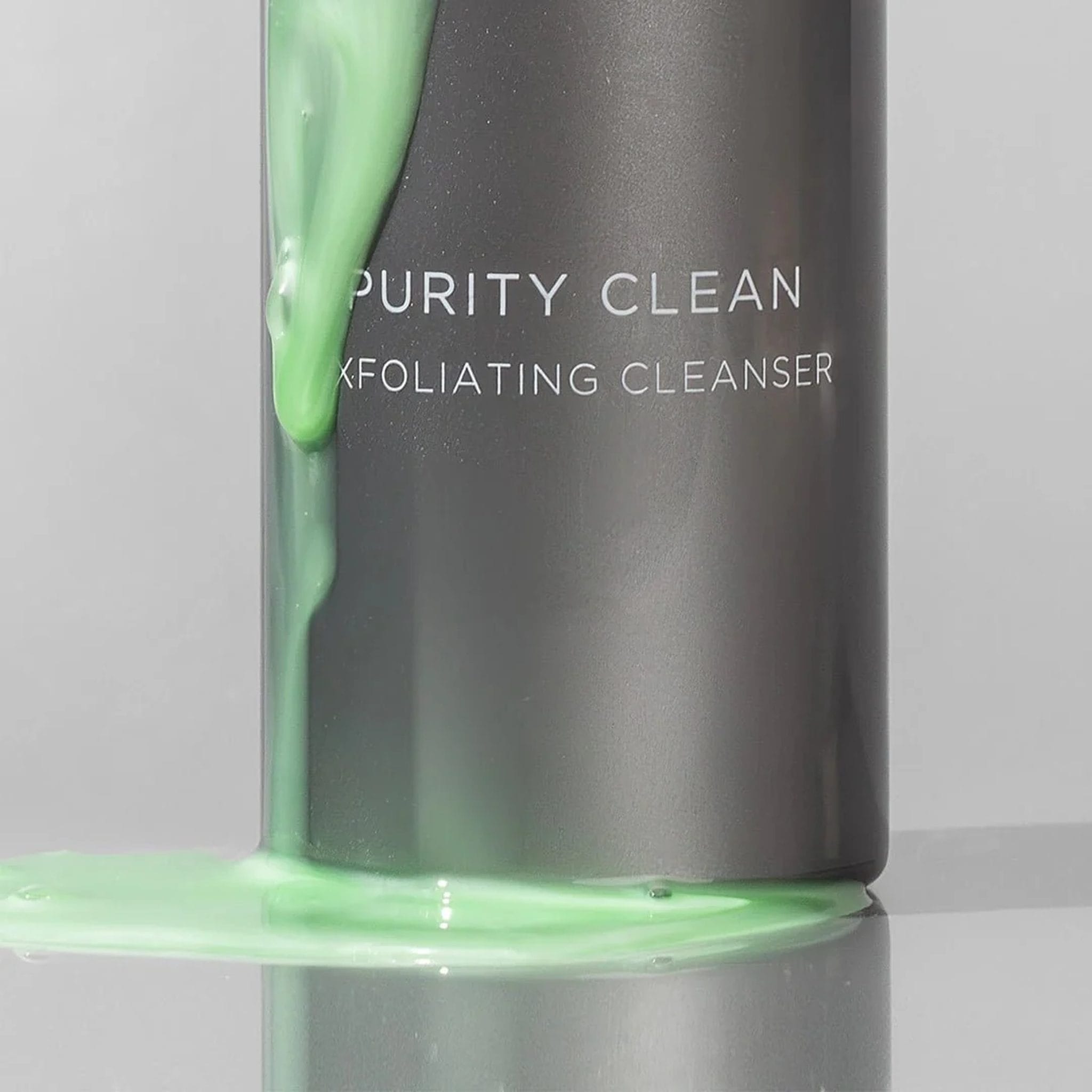 Cosmedix Purity Clean exfoliating cleanser gel pouring down its bottle