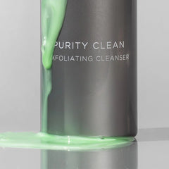 Cosmedix Purity Clean exfoliating cleanser gel pouring down its bottle