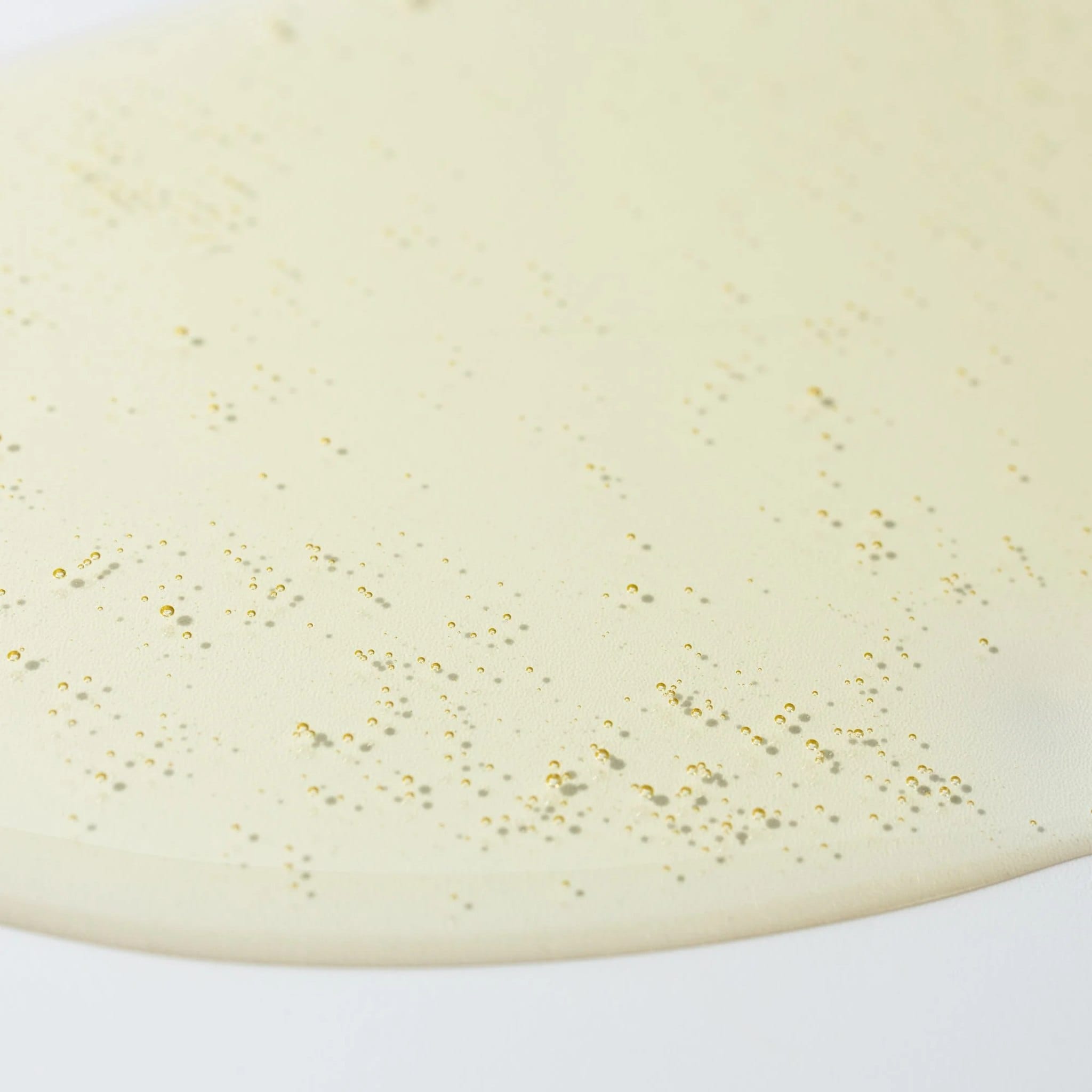 Close-up of Cosmedix Purity Solution nourishing cleansing oil's golden texture
