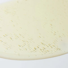 Close-up of Cosmedix Purity Solution nourishing cleansing oil's golden texture