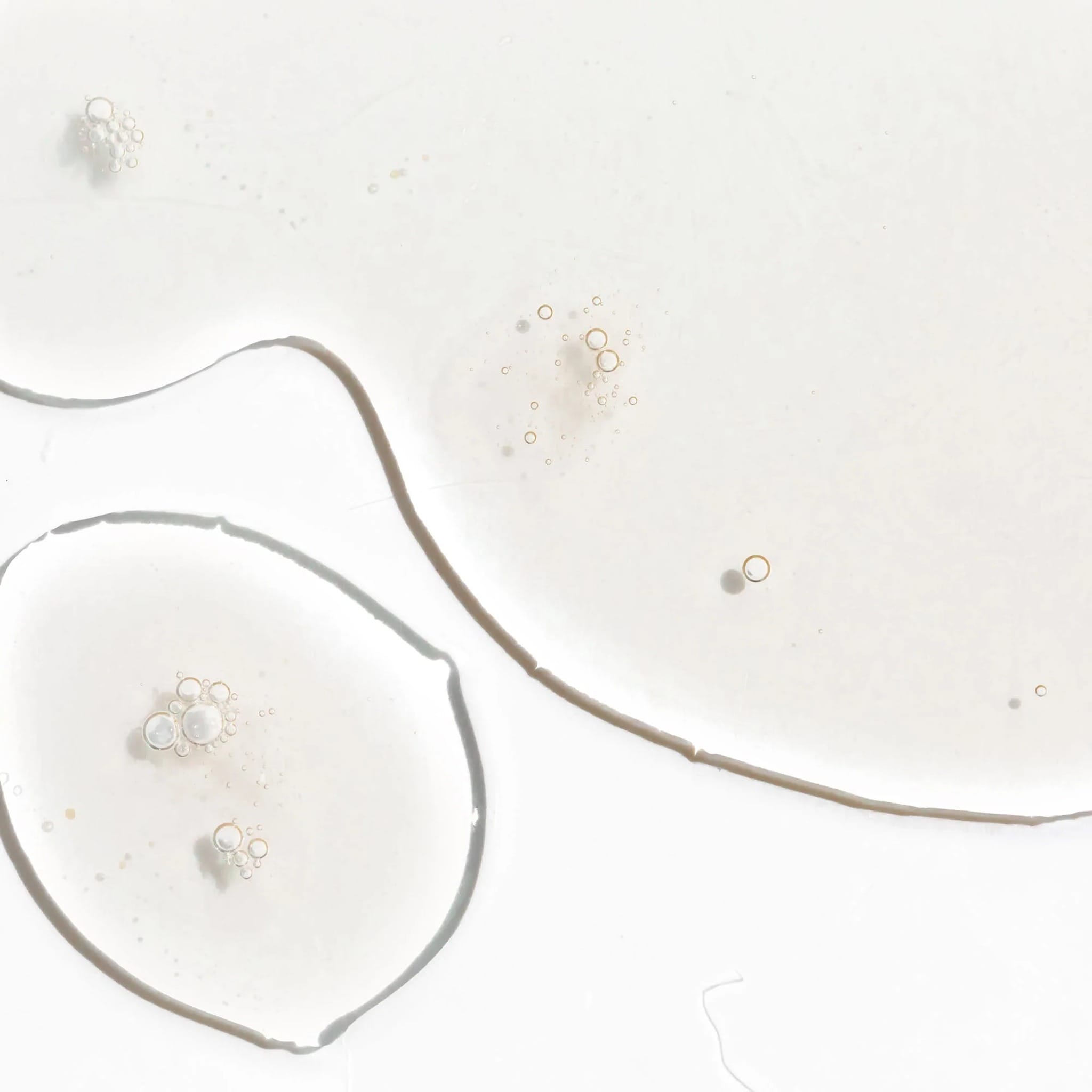 Close-up of Cosmedix Surge hyaluronic acid booster's clear gel texture