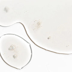 Close-up of Cosmedix Surge hyaluronic acid booster's clear gel texture