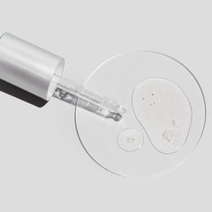 Cosmedix Surge hyaluronic acid booster texture swatch beside its dropper