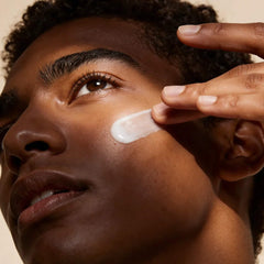 Person applying Cyspera Intensive Pigment Corrector cream to cheek for dark spot and melasma treatment skincare routine