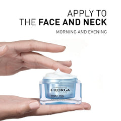 Hands holding open Filorga Hydra-Hyal cream jar with instructions to apply to face and neck morning and evening