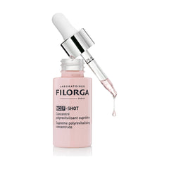 Filorga NCEF-Shot open bottle with dropper pipette showing pink serum dripping on white background