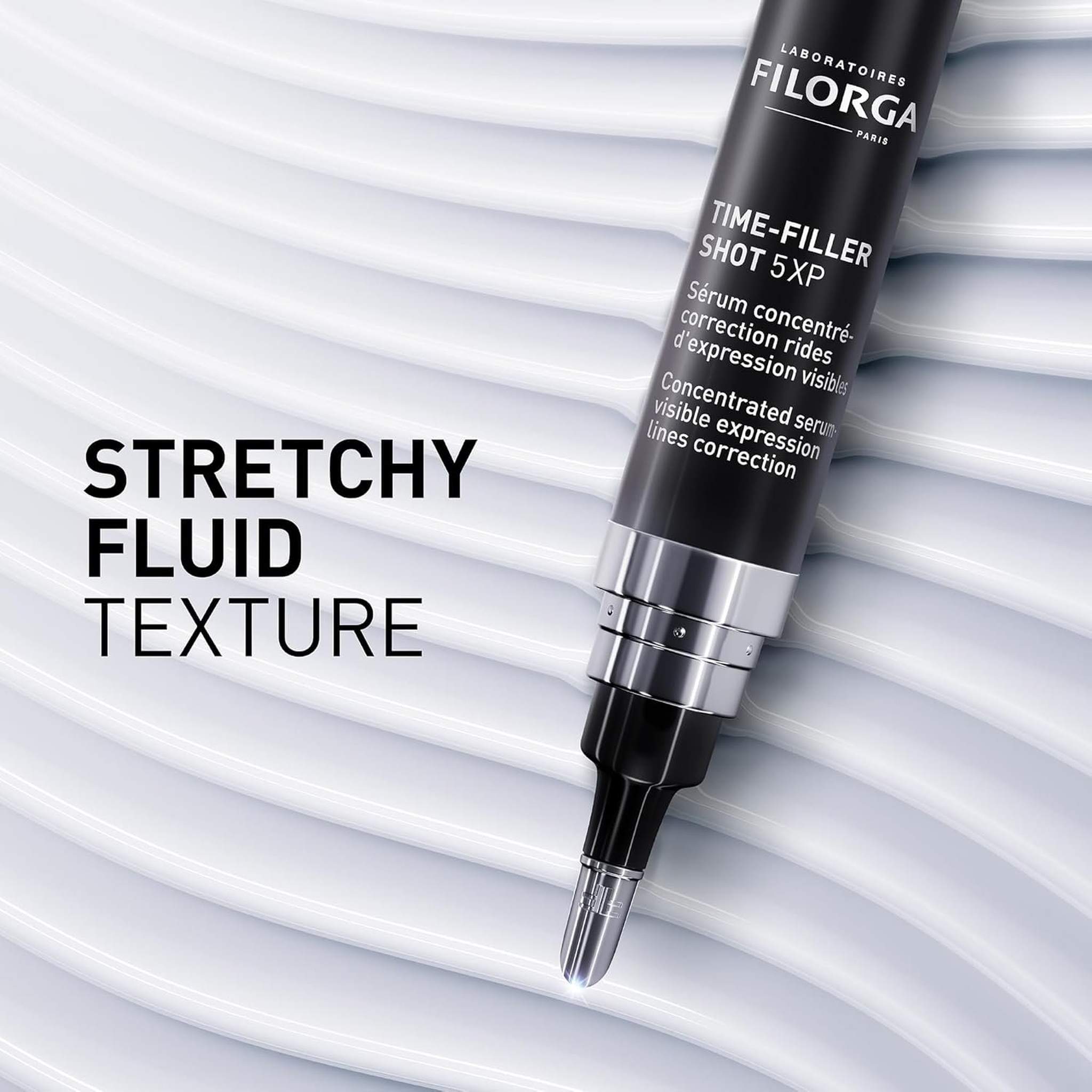 Filorga Time-Filler Shot 5XP stretchy fluid texture pen applicator on wavy surface