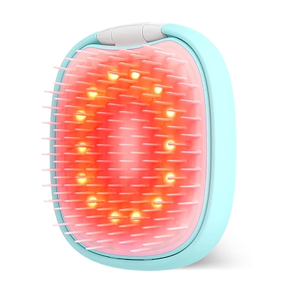 Angled view of FOREO FLIP LED detangling hair brush glowing with red light through flexible bristles
