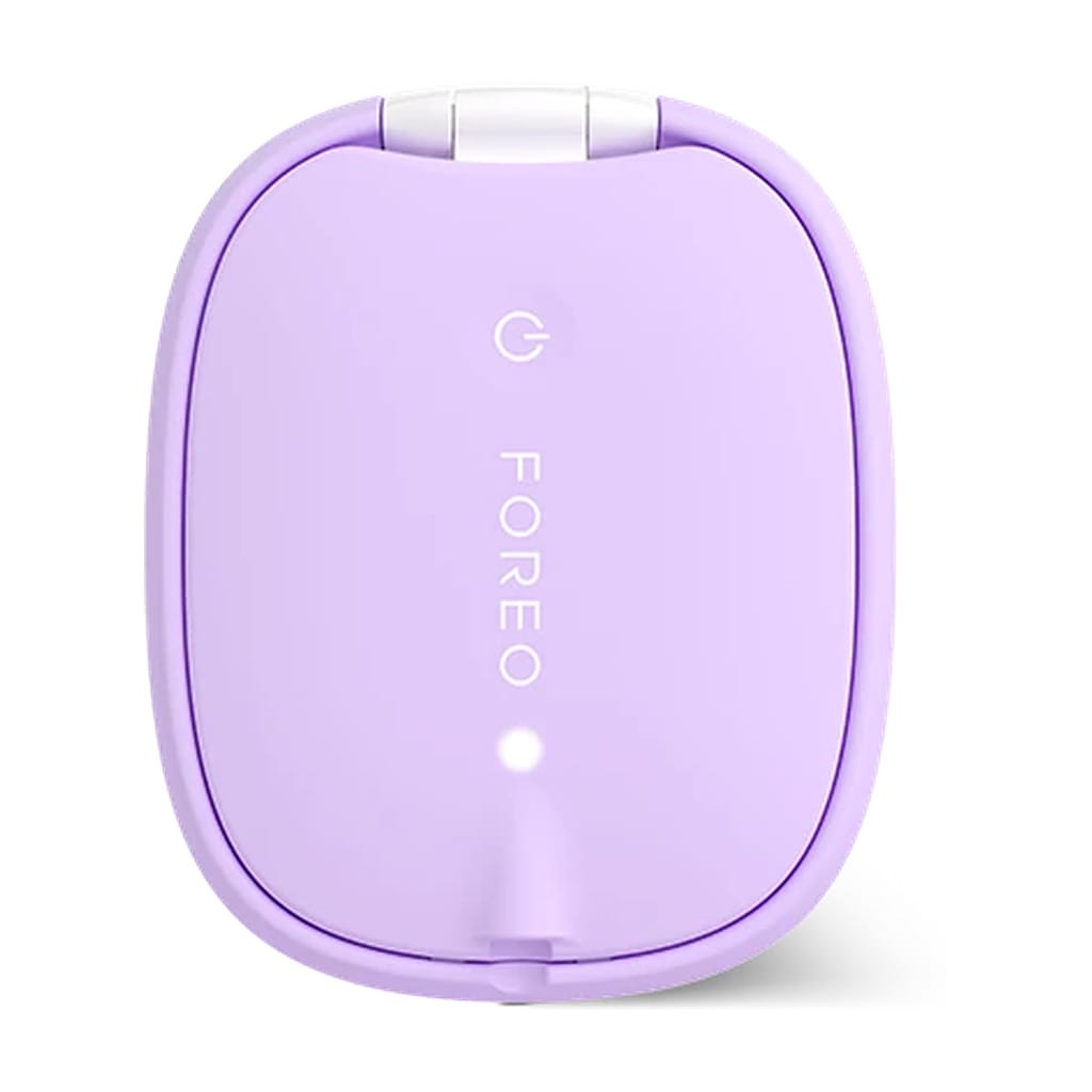 Back of FOREO FLIP plus LED hair brush in lavender showing power button and LED indicator