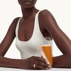 goop Beauty GOOPGLOW Morning Skin Superpowder antioxidant skin supplement drink mix with vitamin C, vitamin E, and CoQ10 for healthy glowing skin. Available at Exclusive Beauty Club.