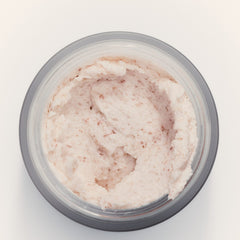 Open jar of goop beauty Himalayan Salt Scalp Scrub Shampoo showing pink salt scrub texture
