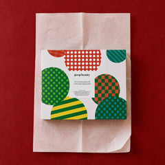 goop beauty Everything Shower Kit gift box wrapped in tissue paper on red background