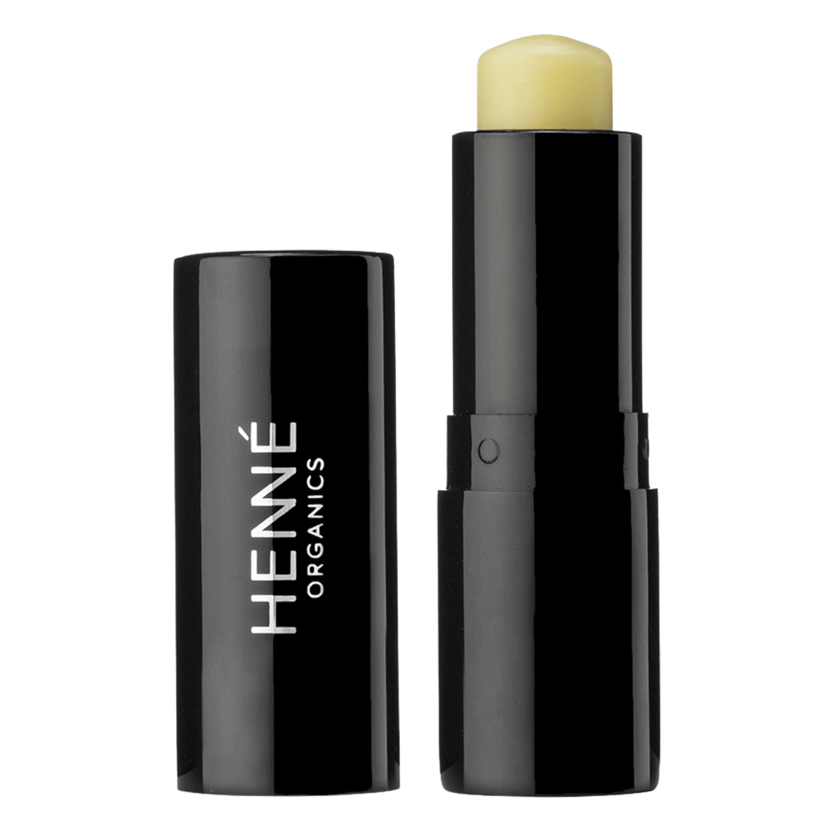 Henné Organics Luxury Lip Balm stick uncapped beside its black cap showing the pale yellow nourishing balm