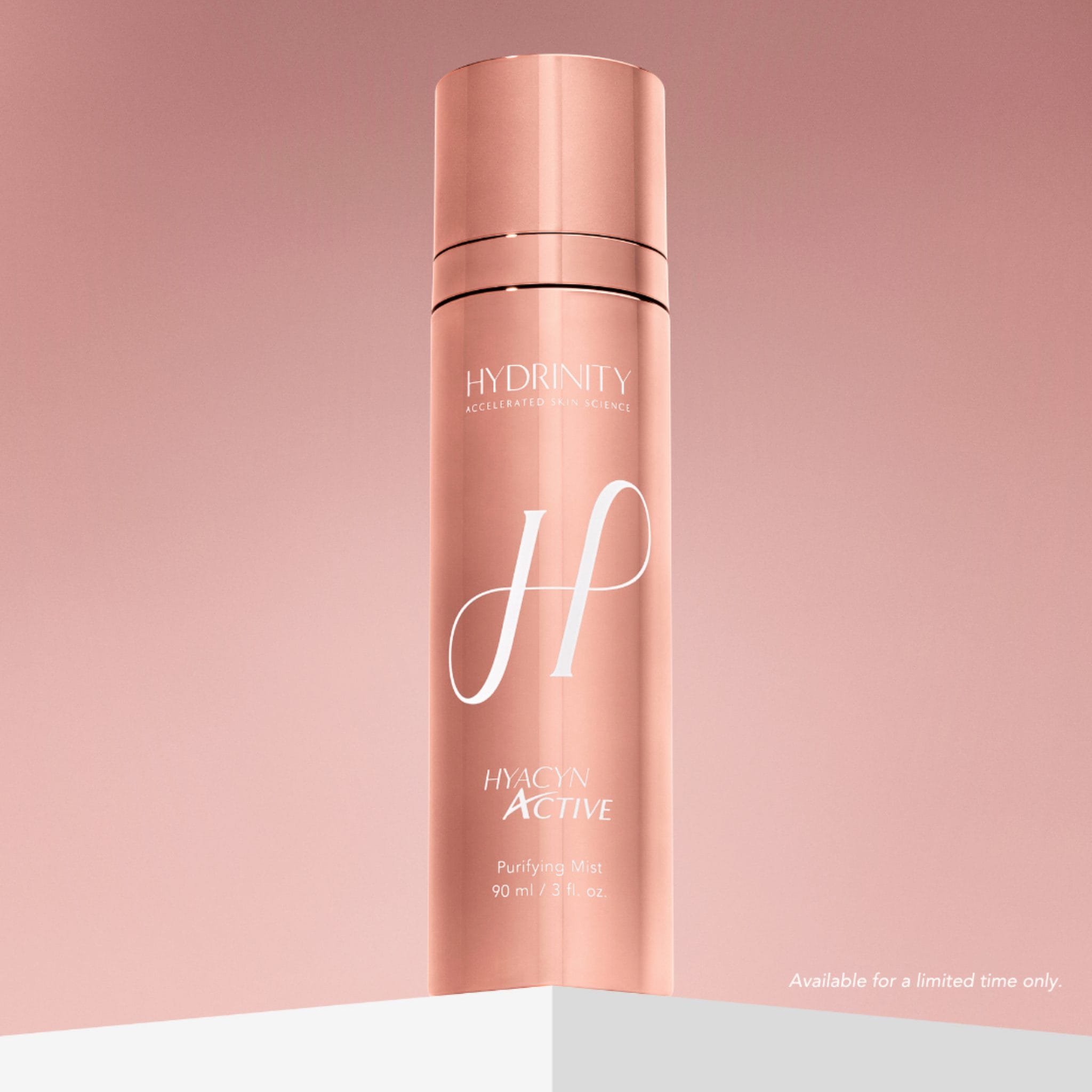 Hydrinity Hyacyn Active Purifying Mist rose gold bottle on pink gradient background