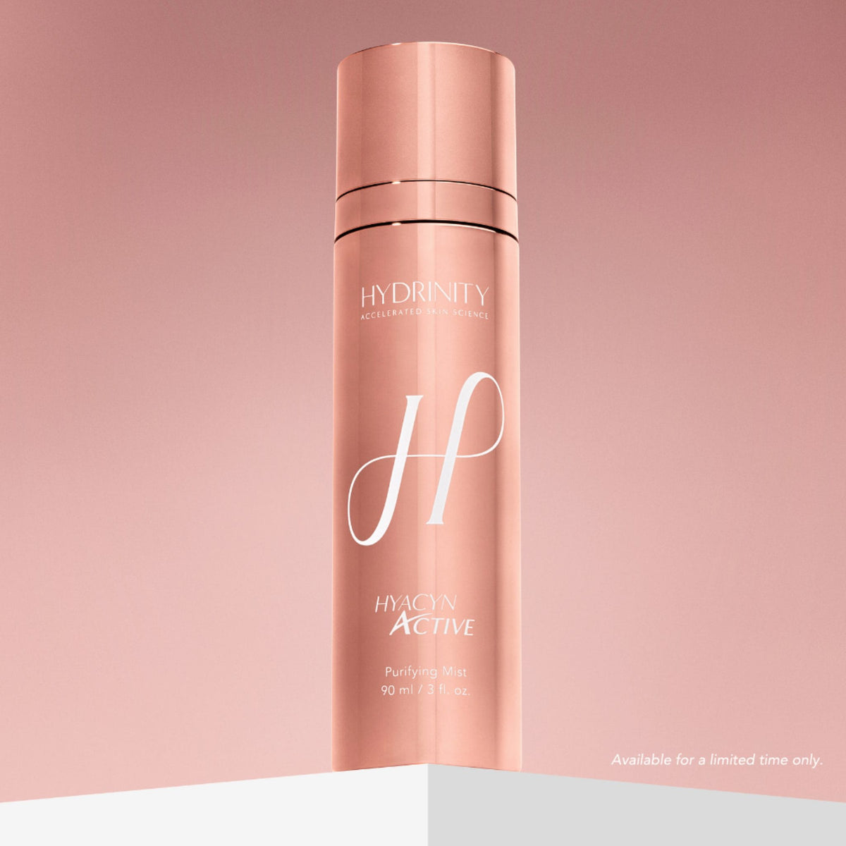 Hydrinity Hyacyn Active Purifying Mist rose gold bottle on pink gradient background