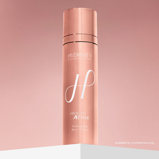 Hydrinity Hyacyn Active Purifying Mist rose gold bottle on pink gradient background