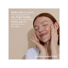 Woman applying tinted mineral sunscreen to face and neck