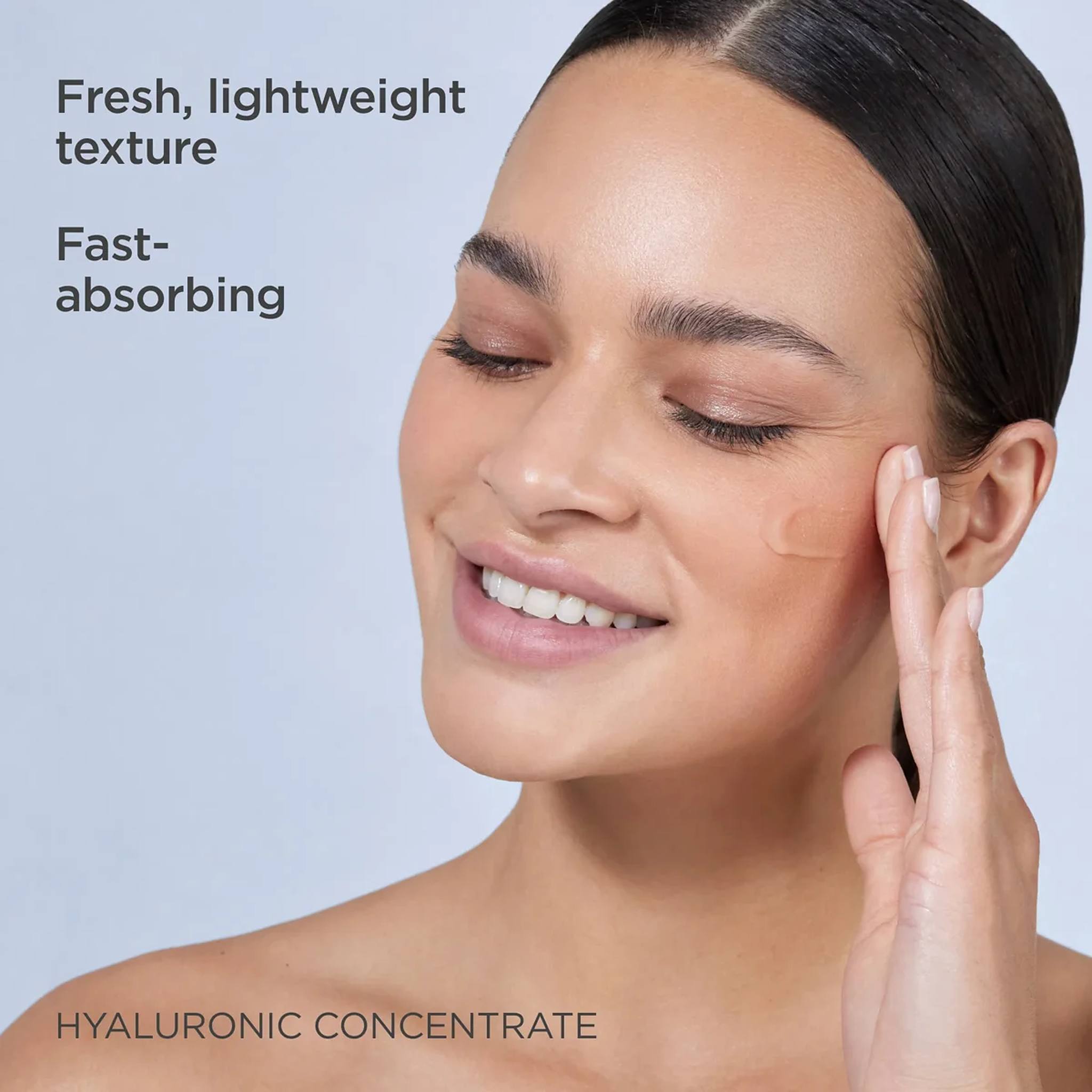 Woman applying ISDIN Hyaluronic Concentrate fresh lightweight fast-absorbing serum to her cheek